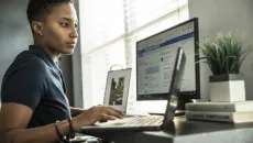 Healthcare billing specialist at her desk