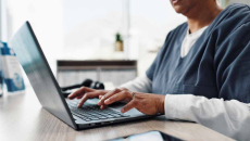 Healthcare worker using a laptop