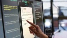 A hand selects text on an AI chatbot touchscreen