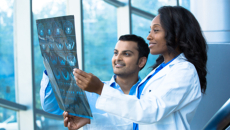 Healthcare workers looking at an X-ray