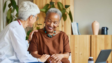 doctor with patient in home