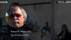 Dr. Robert W. Warren, Epic_Business meeting with interactive screen Photo by Hispanolistic/E+/Getty Images