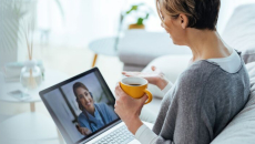 Person talking to doctor on laptop