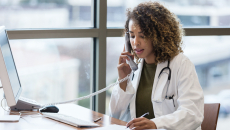 A doctor taking a phone call