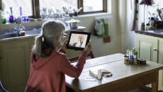 Patient attending telehealth appointment on tablet