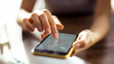 Hands operate a smartphone