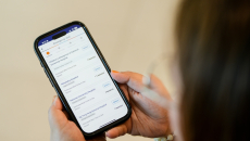 A user checking wait times across NUHS emergency departments on the NUHS mobile application