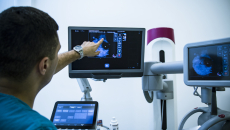 Radiologist examines imaging scan