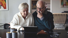 People using a laptop