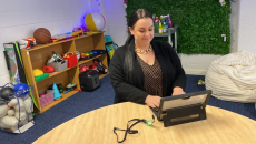 A carer support staff accessing a digital tablet using a passwordless security key