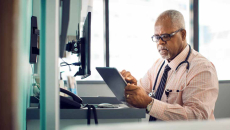 Doctor using tablet