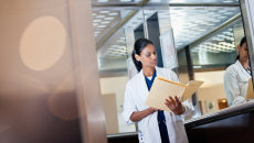 Doctor looking at a folder