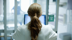 Clinician at a computer terminal