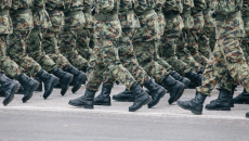 Soldiers in army camouflage walking in formation