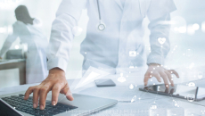 Healthcare professional with tablet and laptop