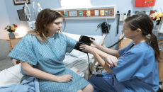 Blood pressure reading at hospital bedside