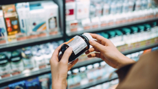 Person looking at pill bottle in Pharmacy