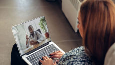 Person attending telehealth appointment on a laptop