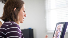 Patient attending telehalth appointment on a tablet