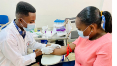 Urgent care clinician draws patient blood