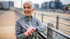 Person in exercise clothes with smartwatch
