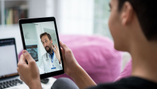 Person talking to doctor on tablet