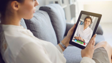 Person talking to healthcare provider on a tablet