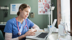 healthcare worker using laptop