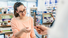 Person recieving a card from a pharmacist