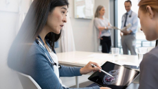 Doctors reviewing a patient's brain scan