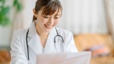 A doctor using a laptop computer