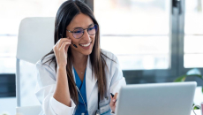 A doctor in a virtual consultation using a laptop computer