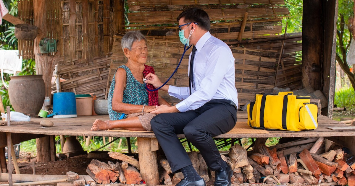 A rural doctor checking up on a patient 