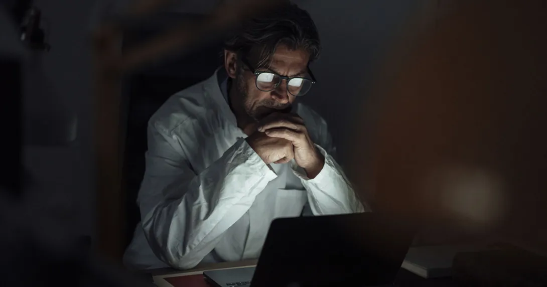 Physician working on laptop