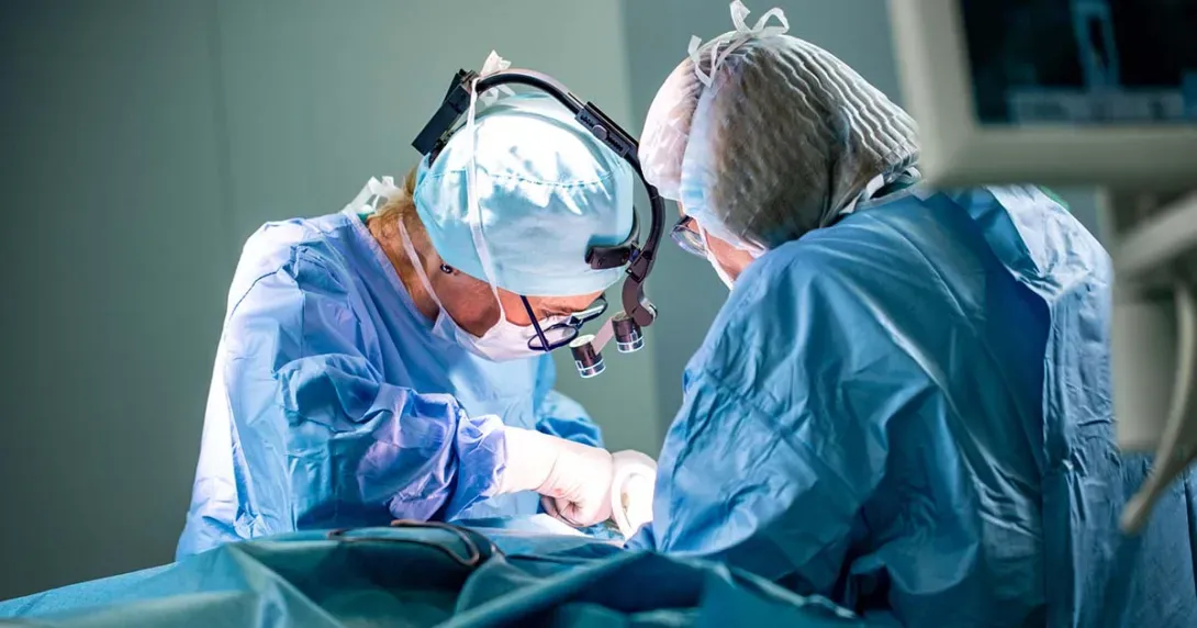 surgeons operating on a patient