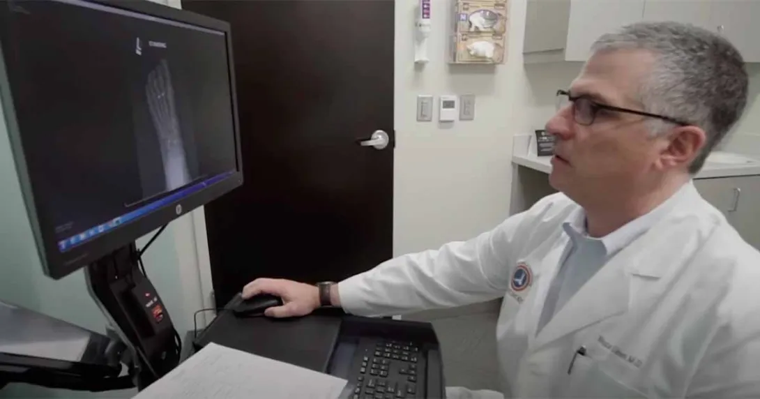 Health professional at desktop computer