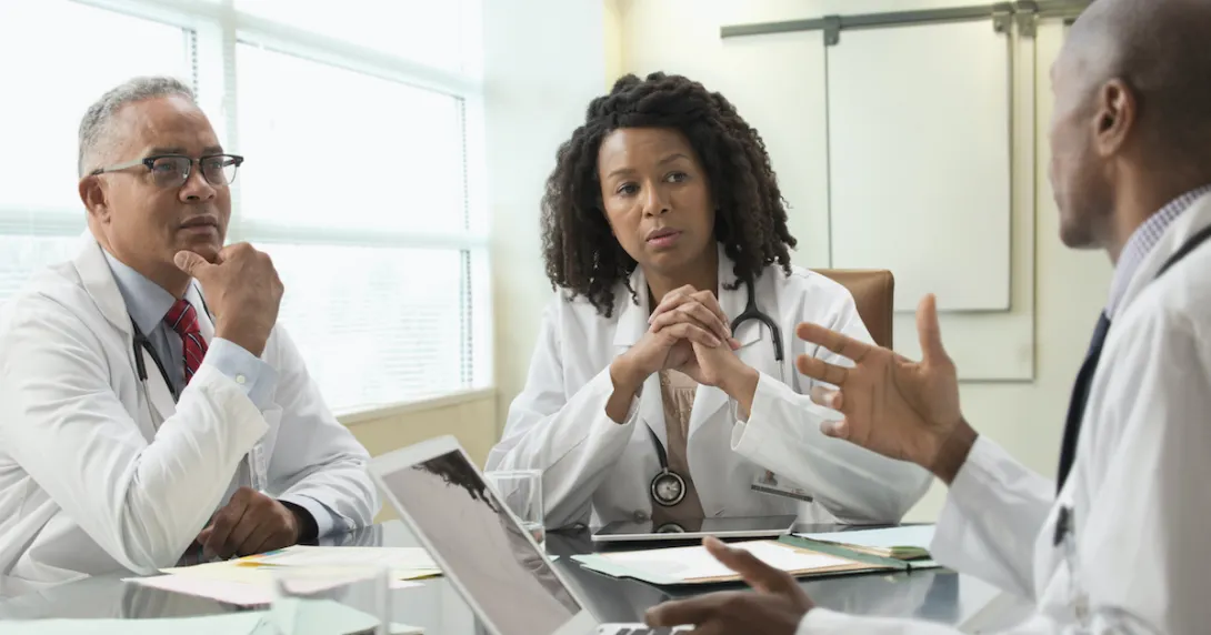 Doctors discussing among themselves in an office