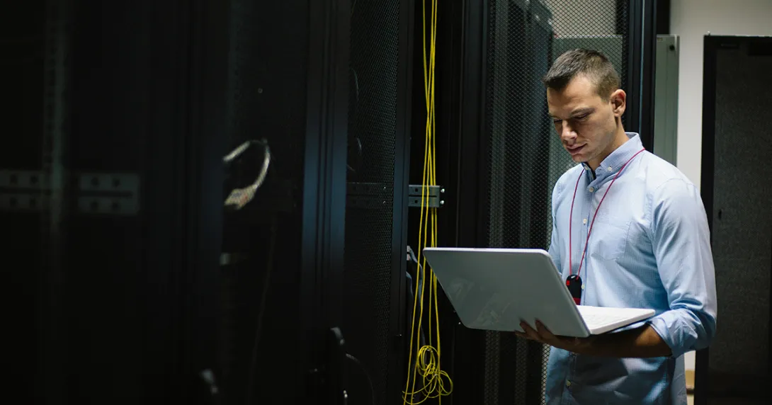 IT worker restores systems in server room