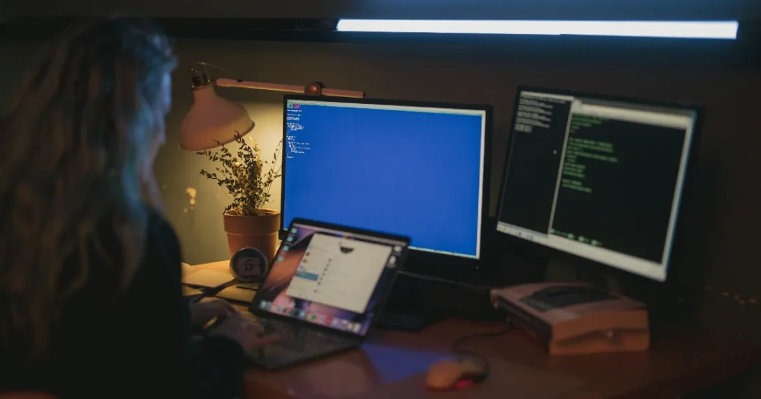 A person in front of computers