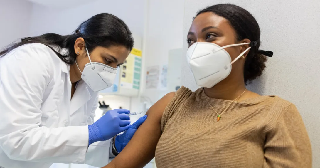 A person getting a vaccine shot