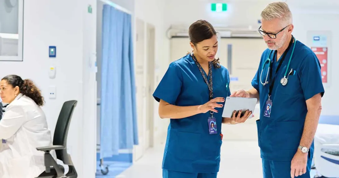 Healthcare workers looking at tablet