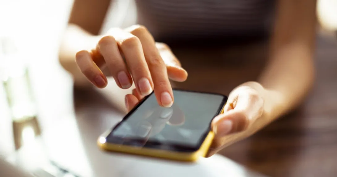 Hands on a smartphone