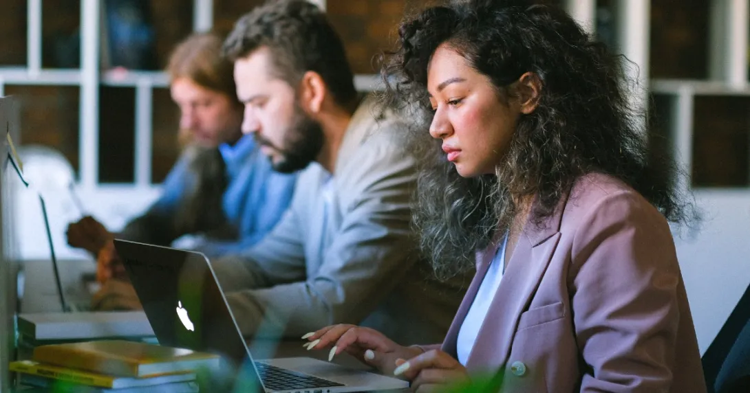 A group of people working at computers