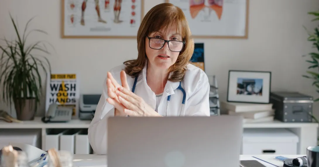 A doctor on a laptop