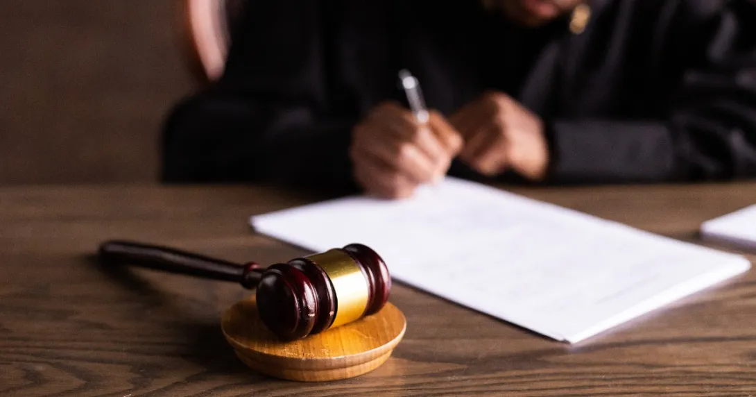 Judge signing a legal document