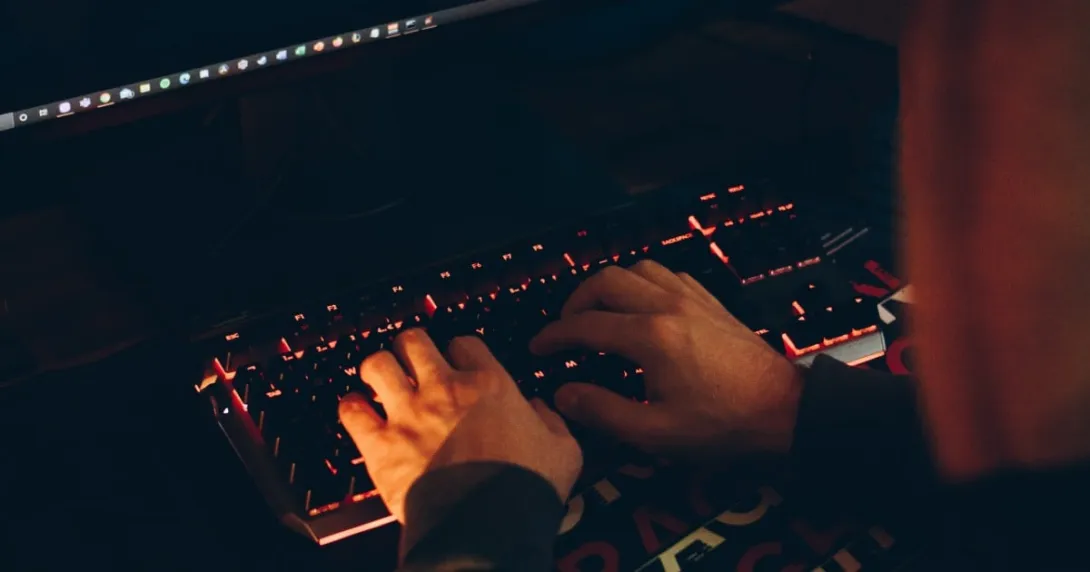 hands typing on keyboard