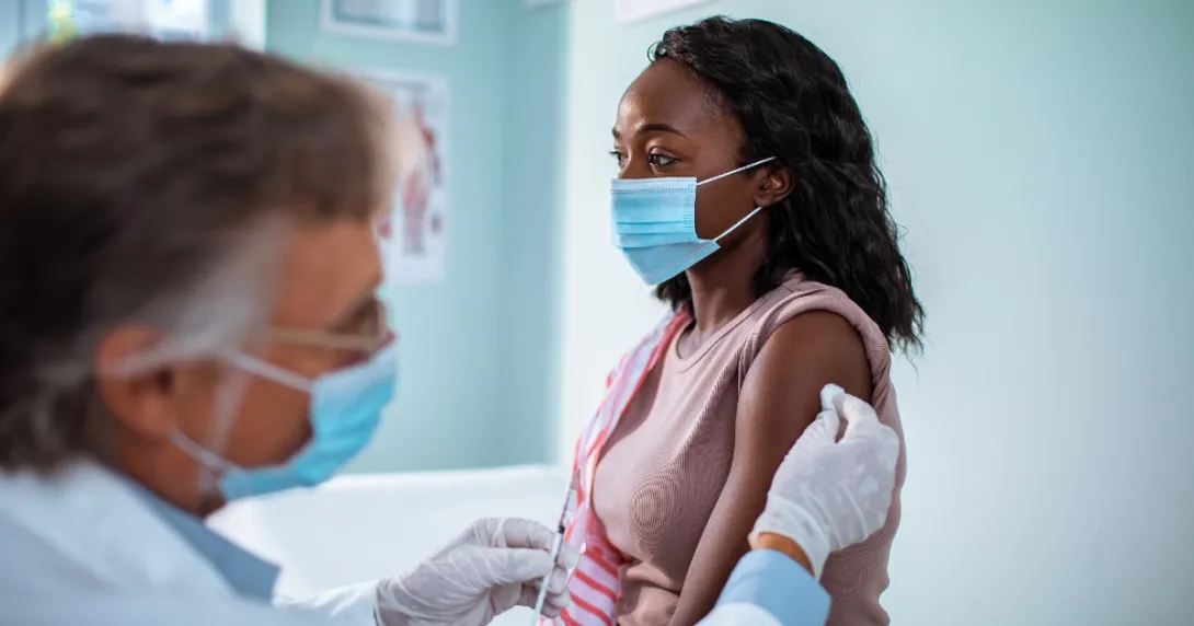 A patient getting vaccinated