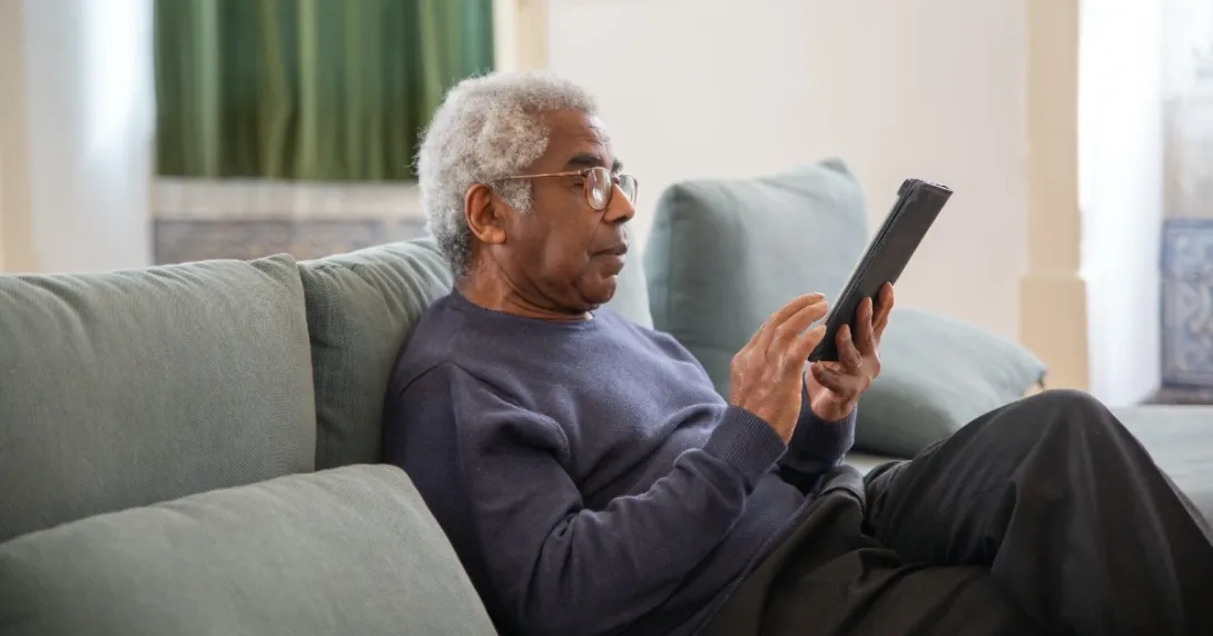 A patient holding a tablet