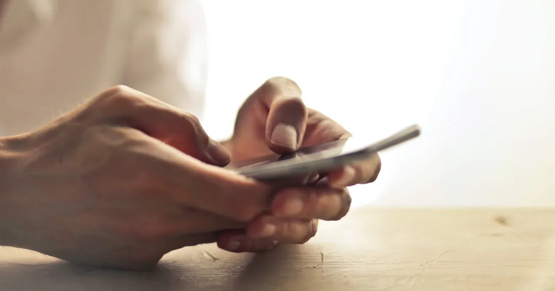 Hands holding smartphone