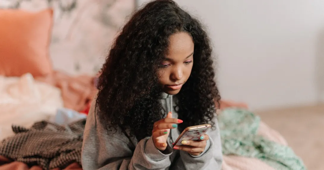 Person at home with smartphone